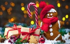 ginger bread man with candy cane and christmas presents