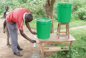 Water Works Charity Team Building Event - recipients using filtration system