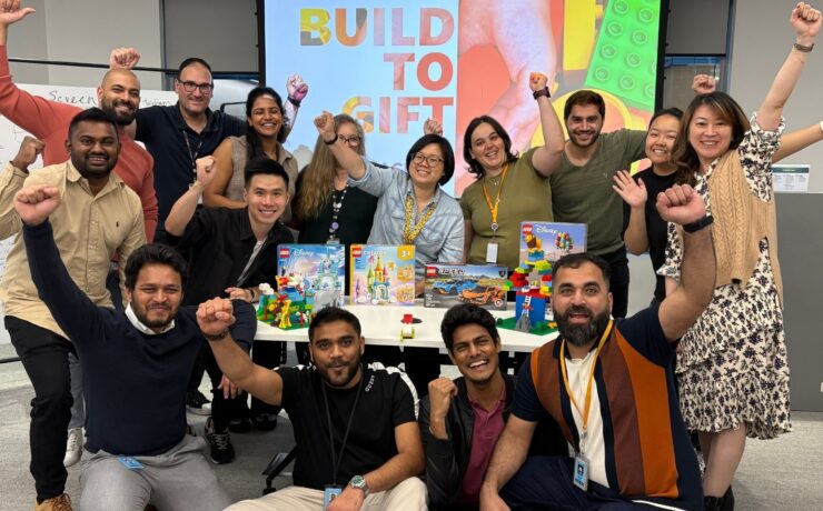 Team cheering after finishing their team building activity