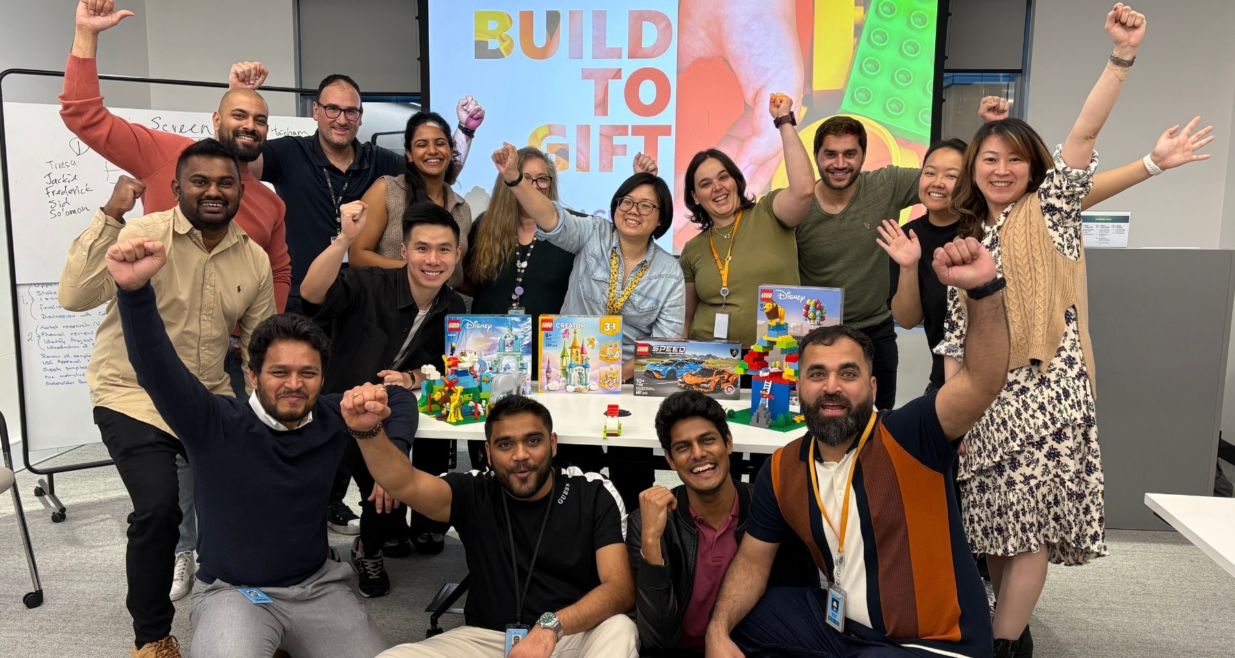 Team cheering after finishing their team building activity