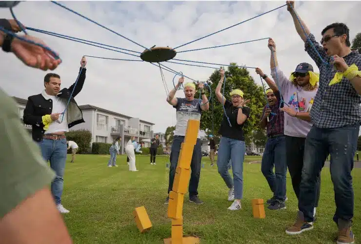 People building a Sky Scraper toegther for the Amazing Race event
