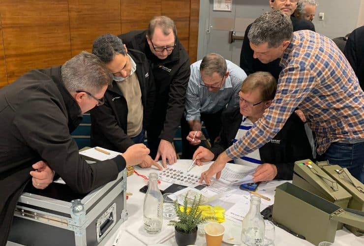 Team working together in team building event called scape the box