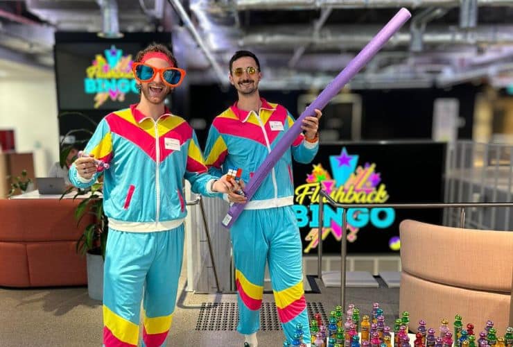 Team building facilitators dressed in fluro for Flashback Bingo